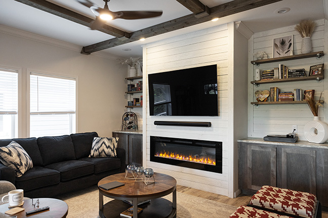 A manufactured home’s living room with an included fireplace